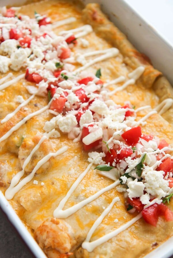 seafood enchiladas with pico de gallo and Mexican creama on top