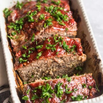 sliced meatloaf with fresh parsley on top.