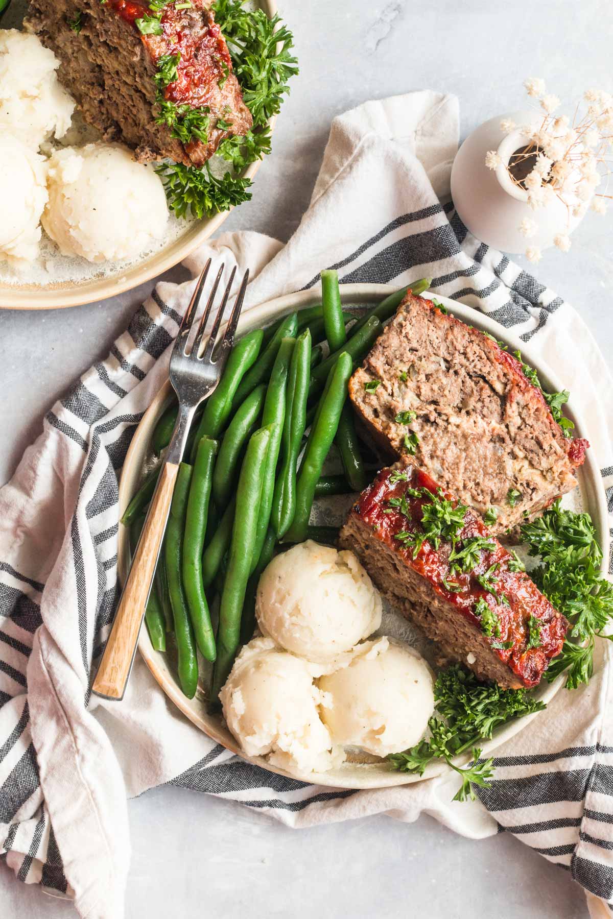 meatloaf with mashed potatoes and green beans. 