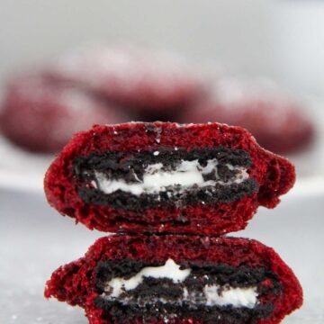 two red velvet fried oreos stacked on top of each other.