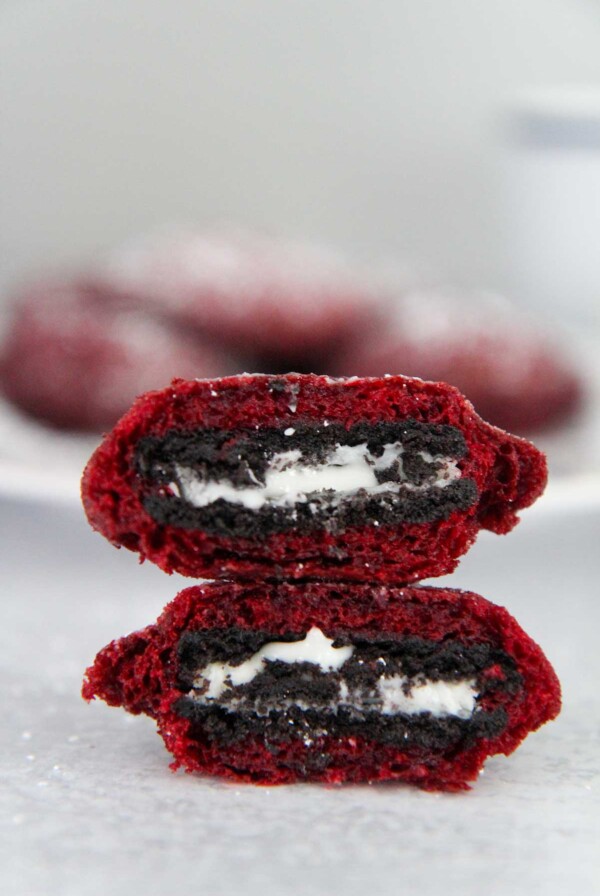 two red velvet fried oreos stacked on top of each other.