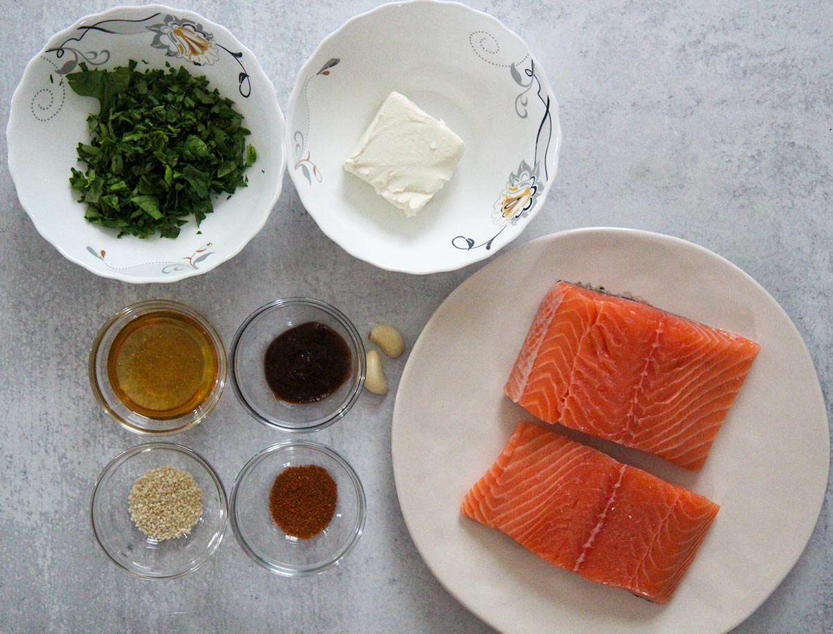what goes into spinach stuffed salmon. Ingredients on a plate and bowls. 