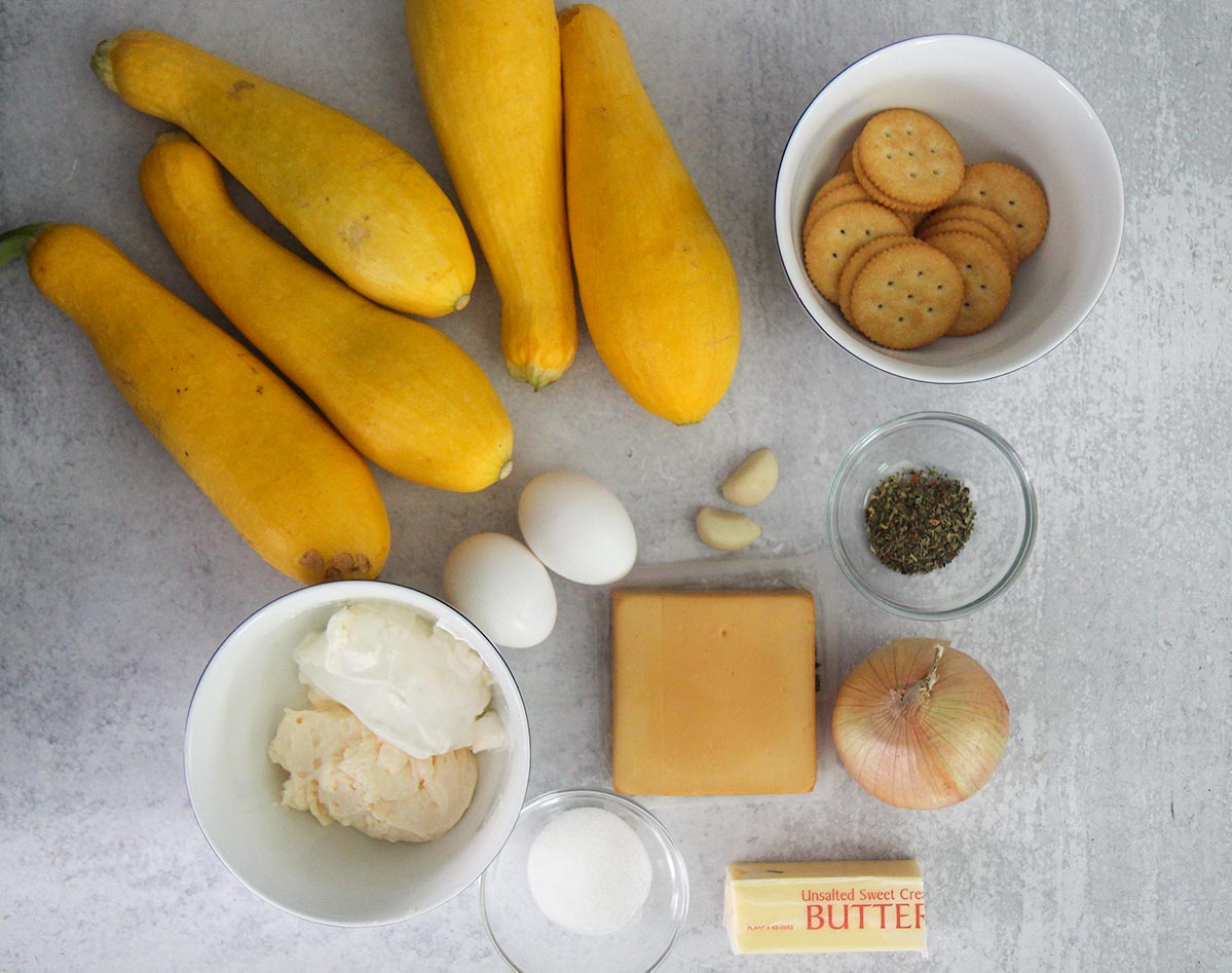 what goes into squash casserole. All of the ingredients on a gray table. 