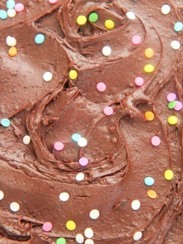 chocolate buttercream frosting with sprinkles up close