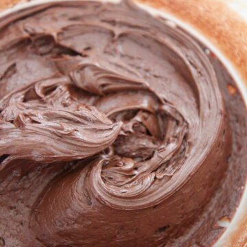 chocolate buttercream frosting in a glass bowl.
