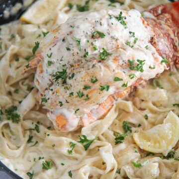 lobster fettuccine alfredo in a skillet.