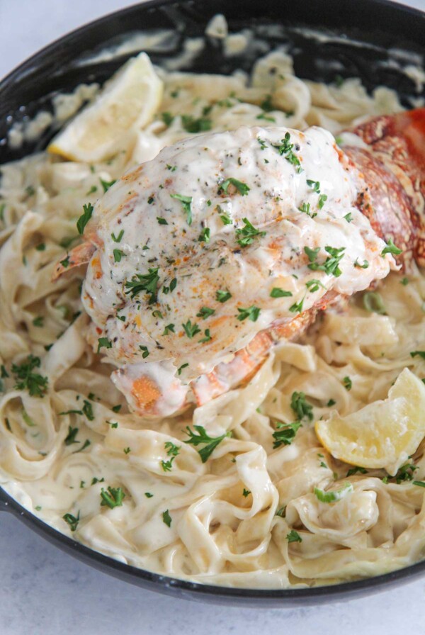 lobster fettuccine alfredo in a skillet.