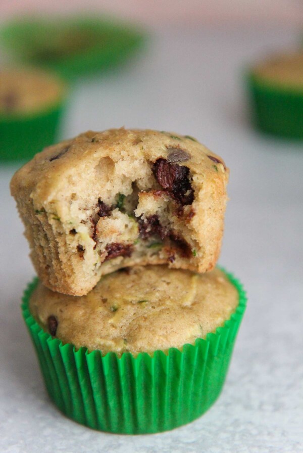 two zucchini chocolate chip muffins stacked
