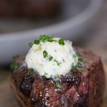 air fryer filet mignon with garlic butter on top.