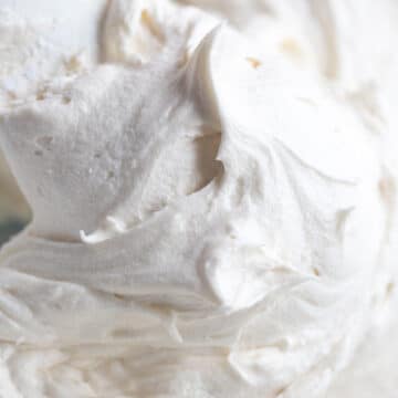 cream cheese frosting with a rubber spatula up close.