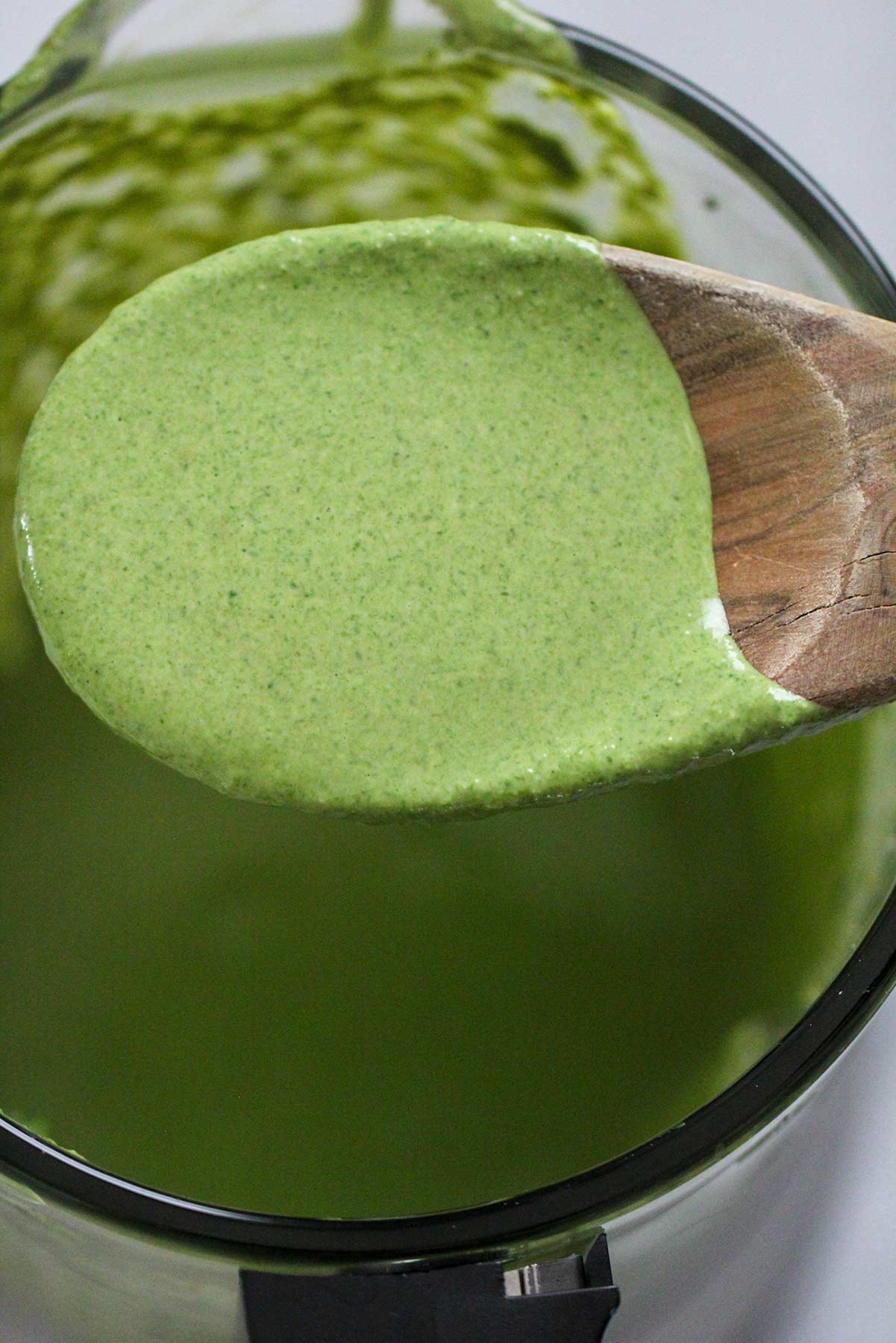 green sauce on a wooden spoon. 