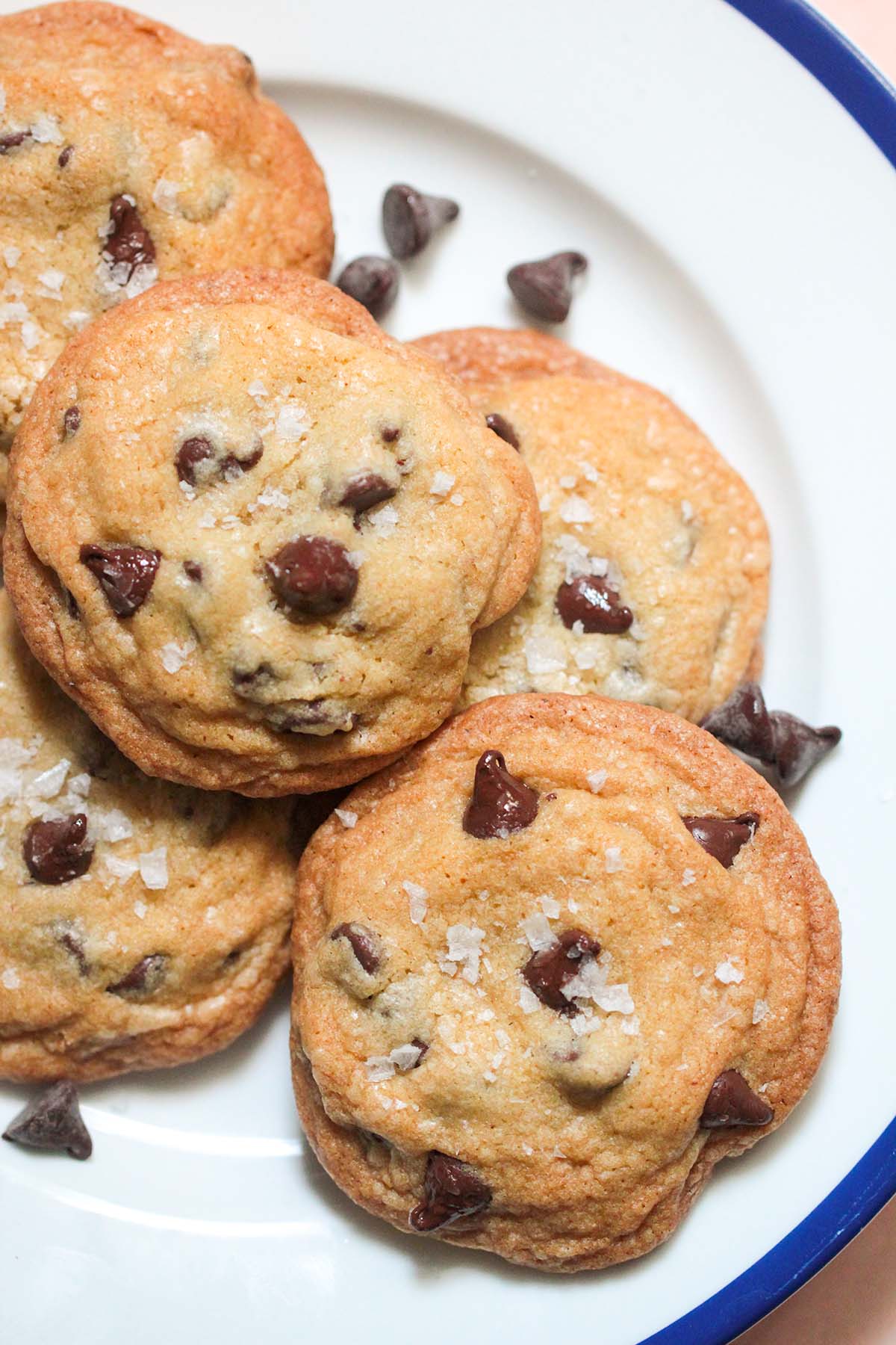 5 brown butter chocolate chip cookies on a plate. 