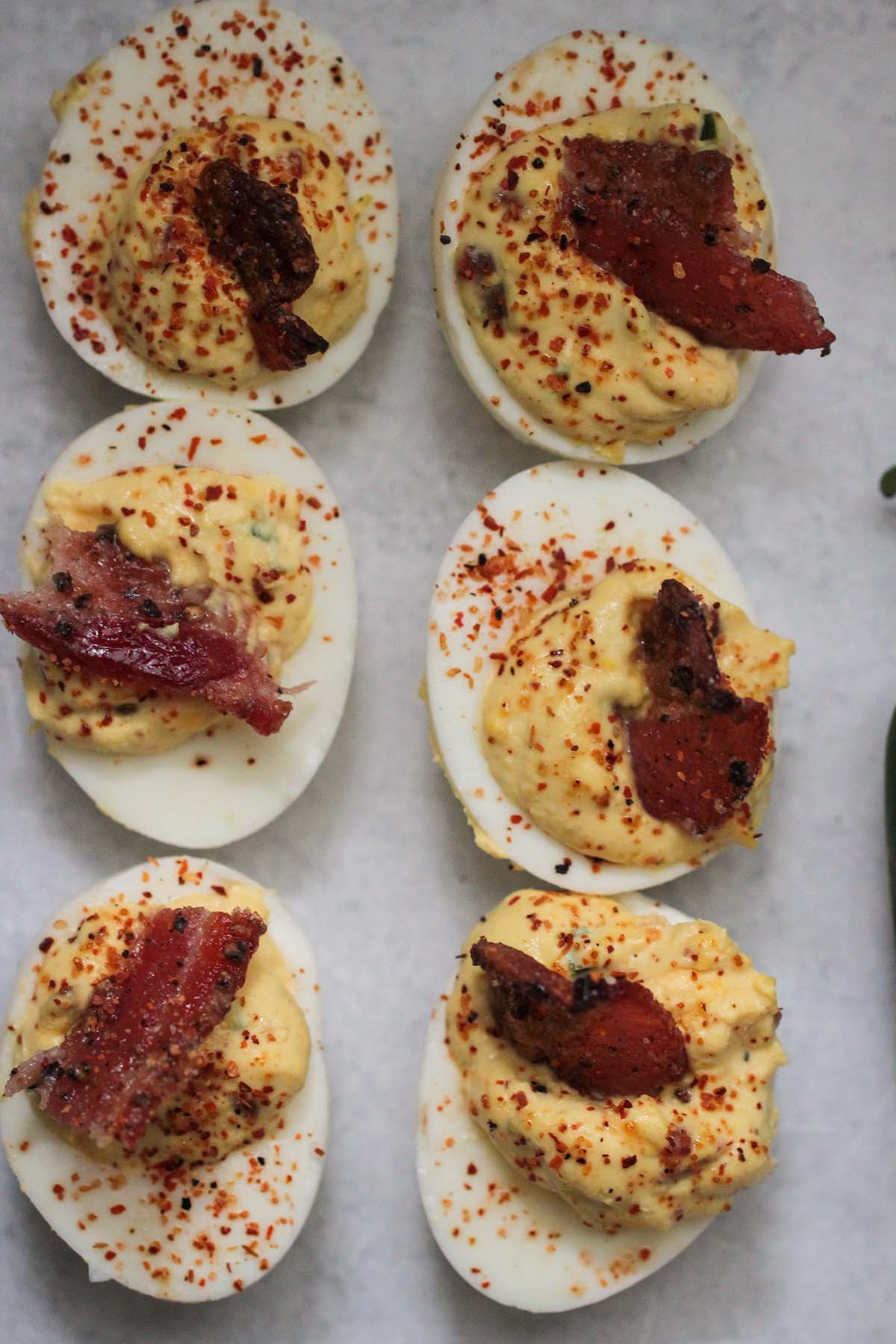 six candied bacon jalapeno deviled eggs. 