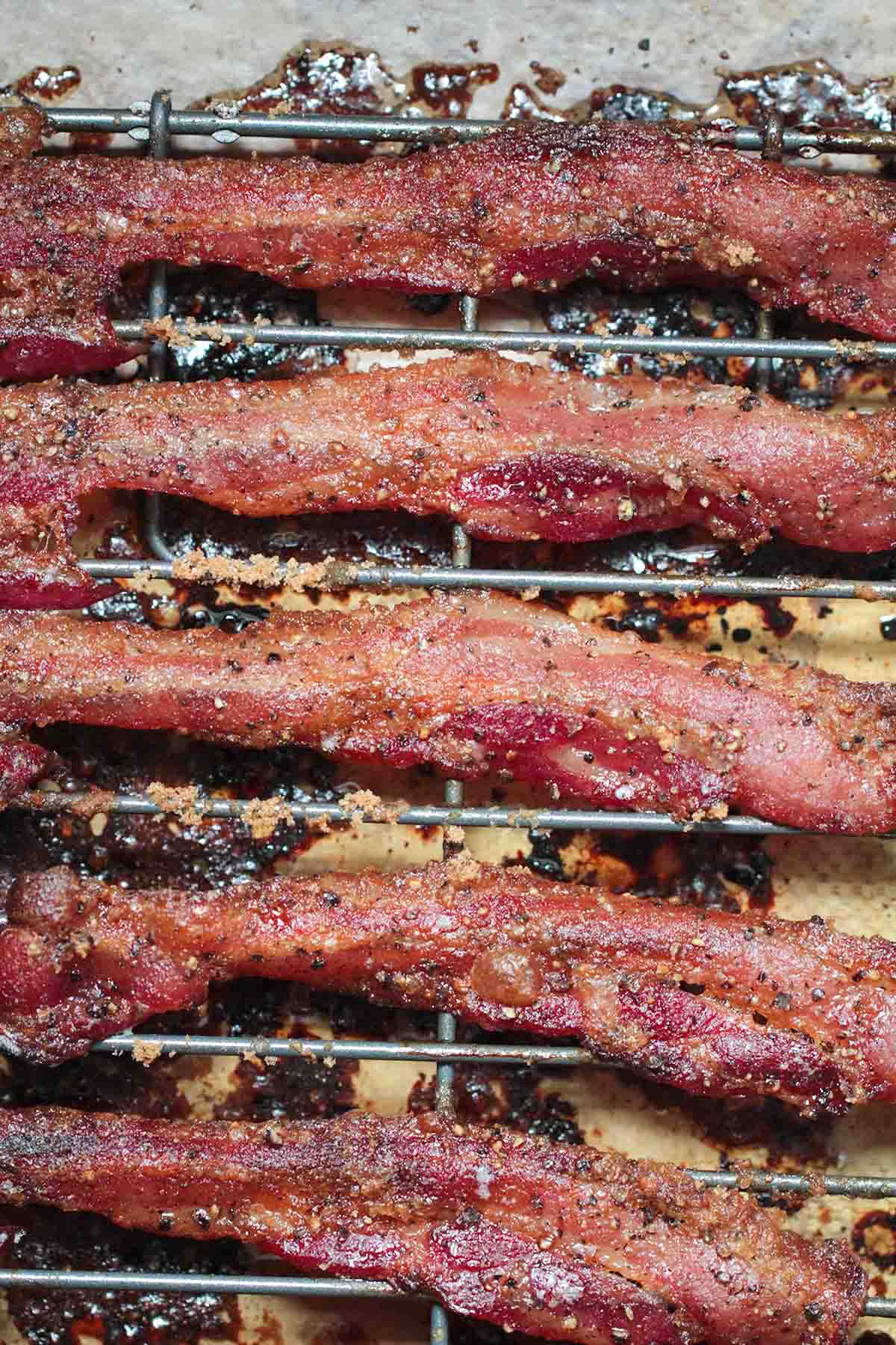 bacon strips on a wire rack. 