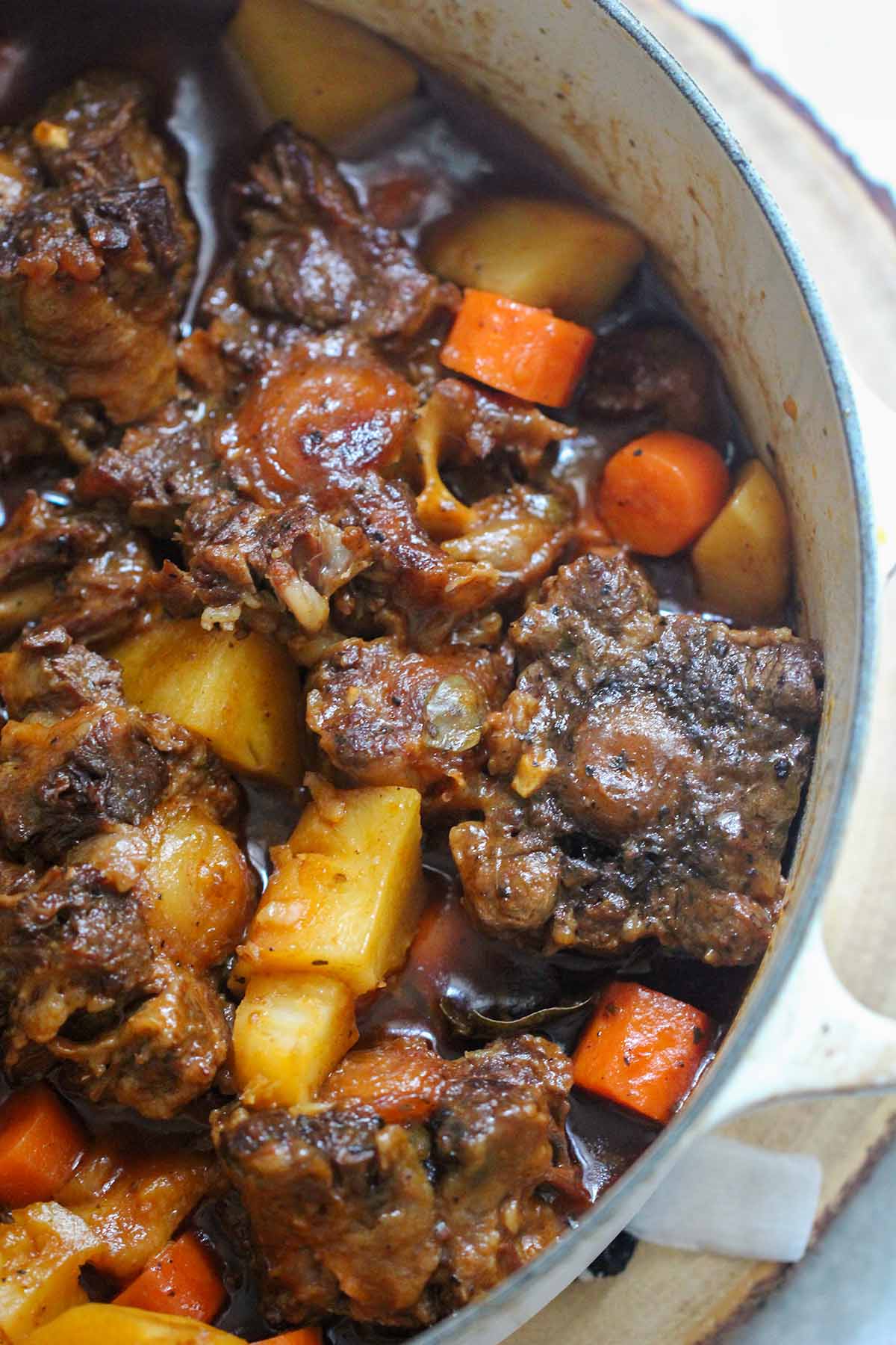 Cuban oxtails in a large dutch oven up close. 