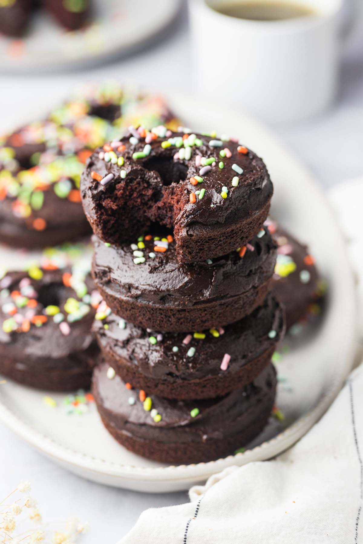 chocolate donuts on a plate. 