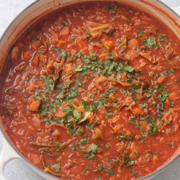 cabbage roll soup in a white pot.