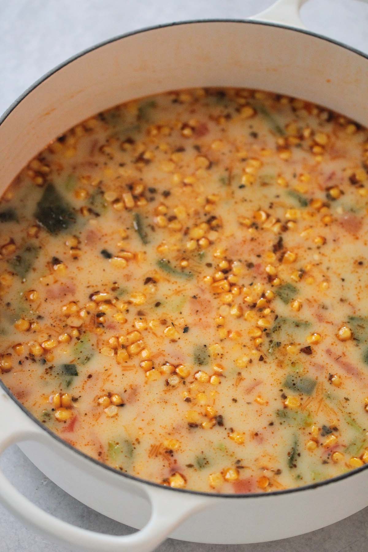 cheese and potato soup (caldo de queso) in a large white pot. 
