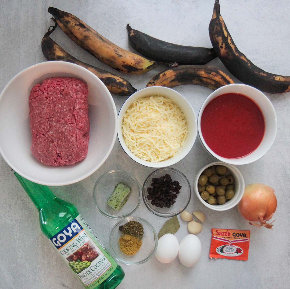 ingredients. platains, beef, cheese, sauce, spices, onion, garlic, sofrito, cooking wine, eggs. 