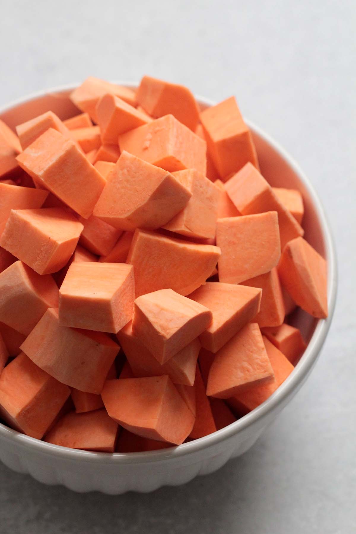 sweet potato cubes in a white bowl. 