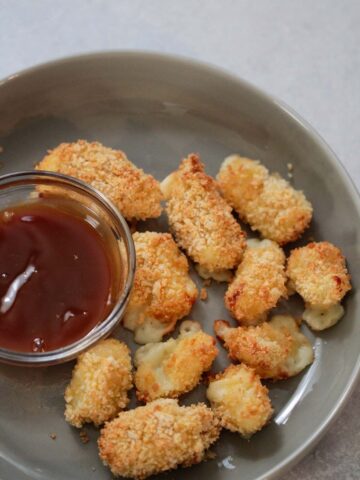 air fryer cheese curds with a side of caramel sauce.