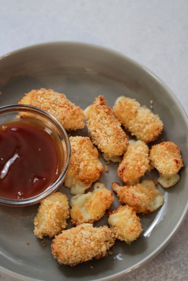 air fryer cheese curds with a side of caramel sauce.