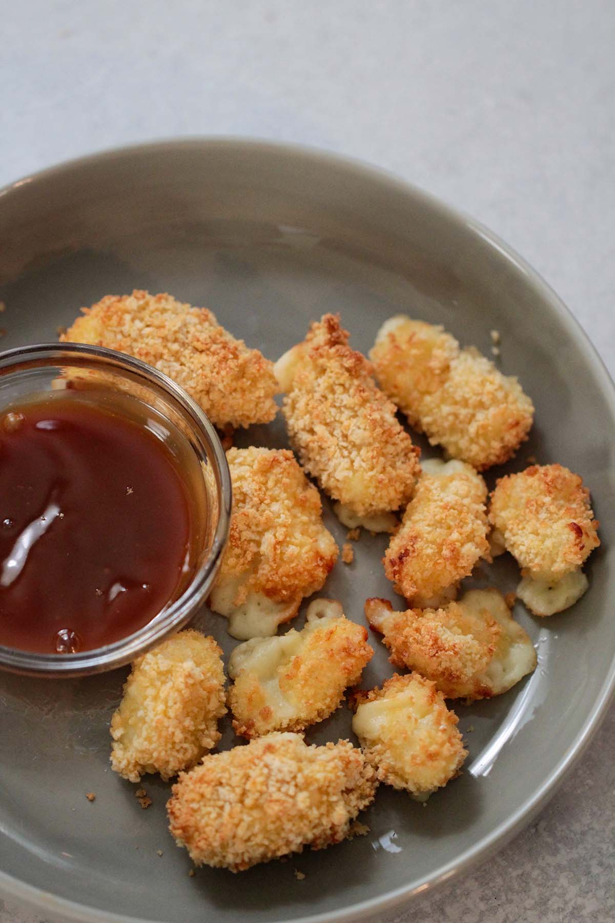 air fryer cheese curds with a side of caramel sauce. 