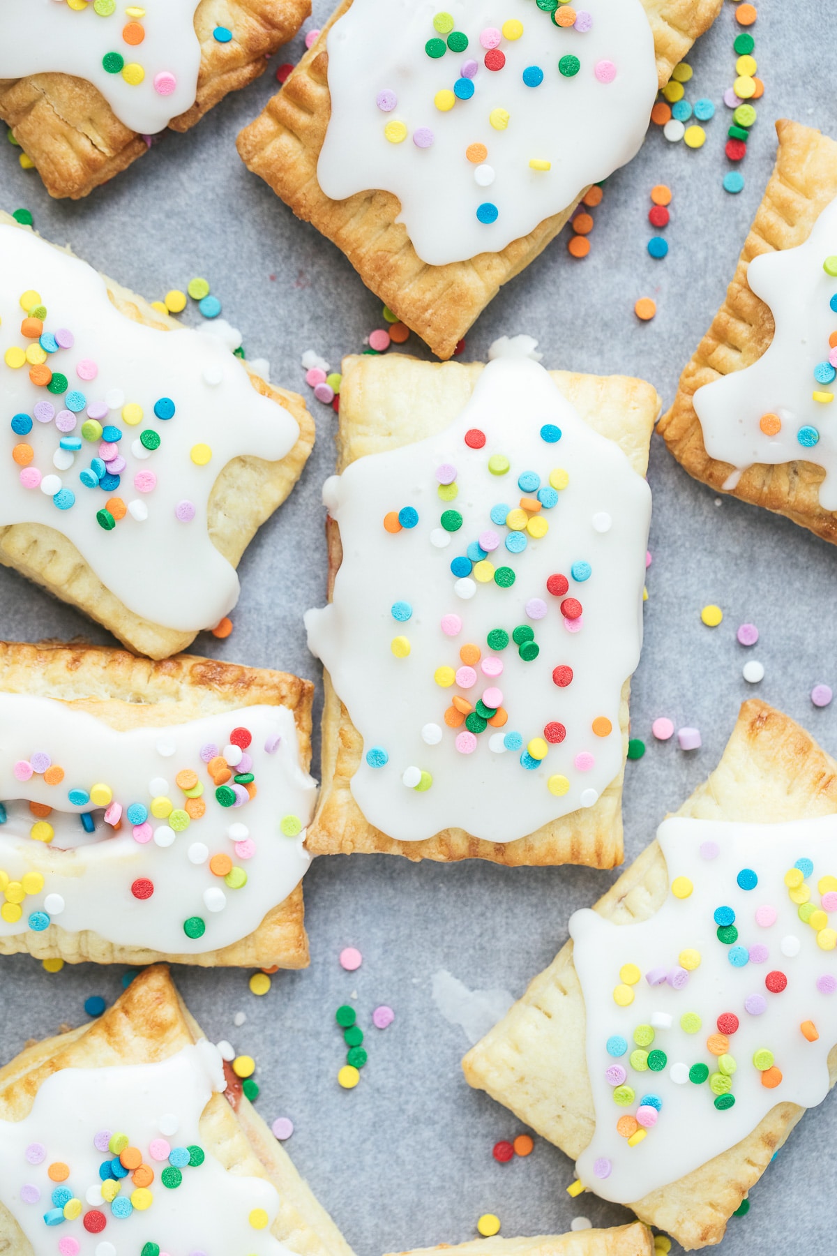 air fryer pop tarts with icing and sprinkles on top. 