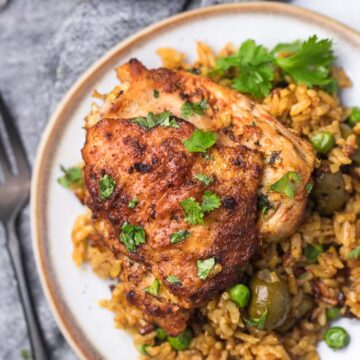 arroz con pollo (chicken and rice) on a plate.
