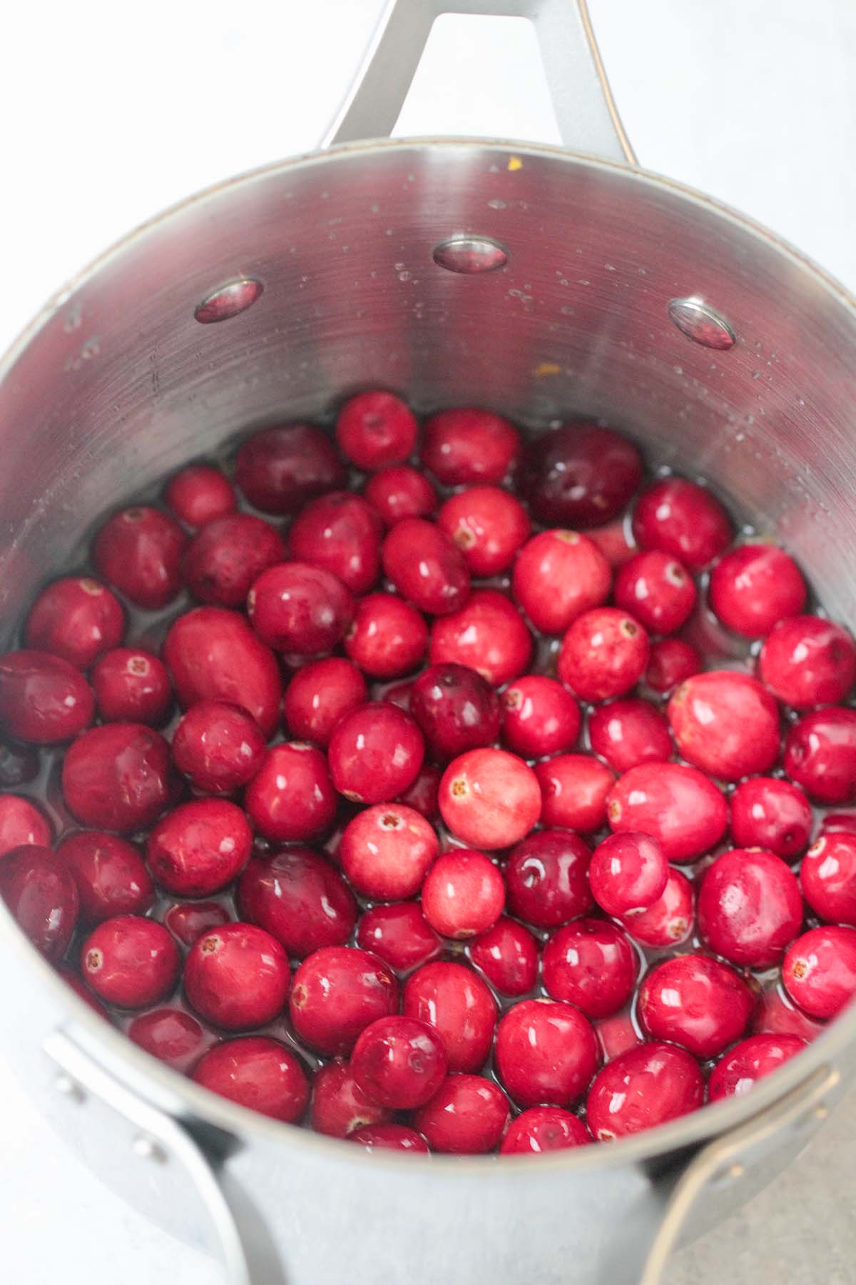 fresh cranberries and liquid in a saucepan. 