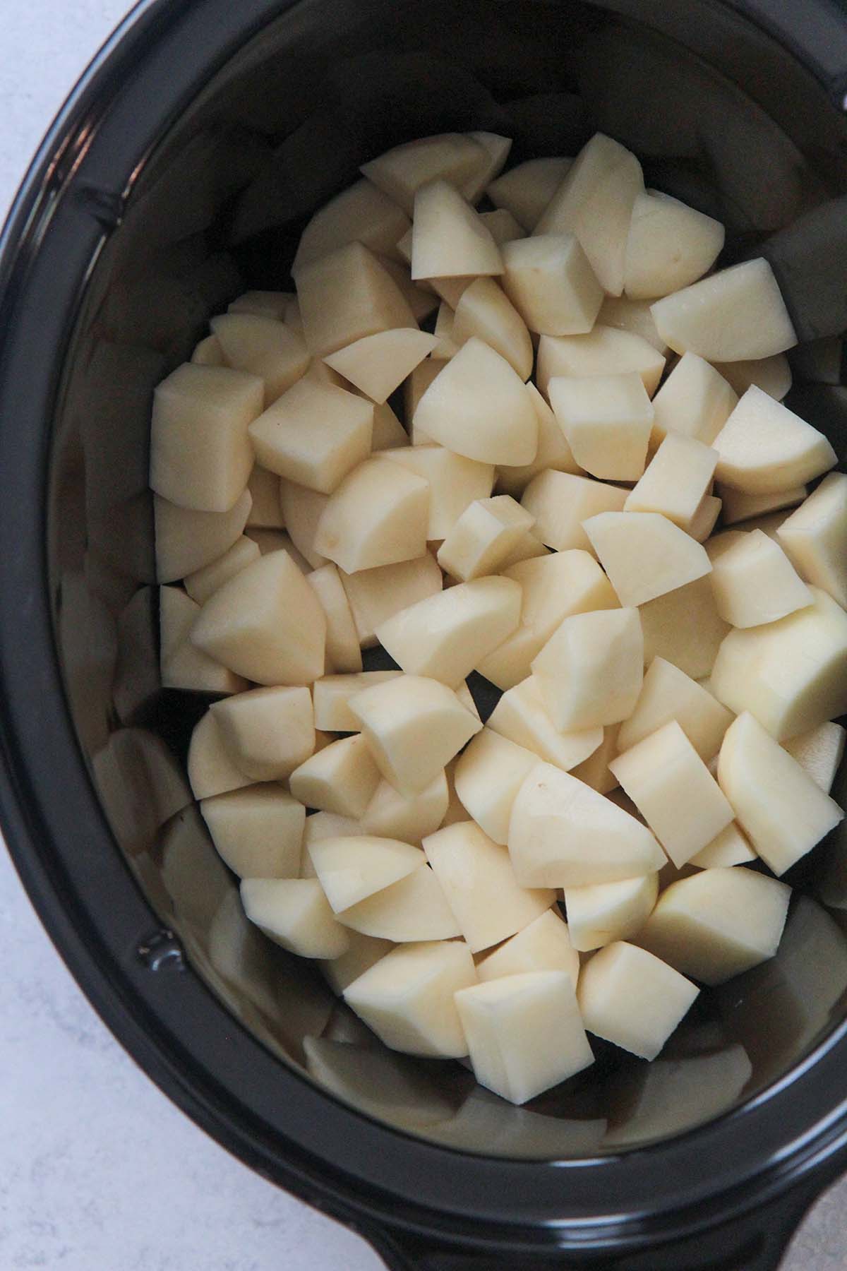 peeled and diced potatoes in the slow cooker. 