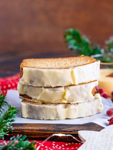 three eggnog bread slices stacked.