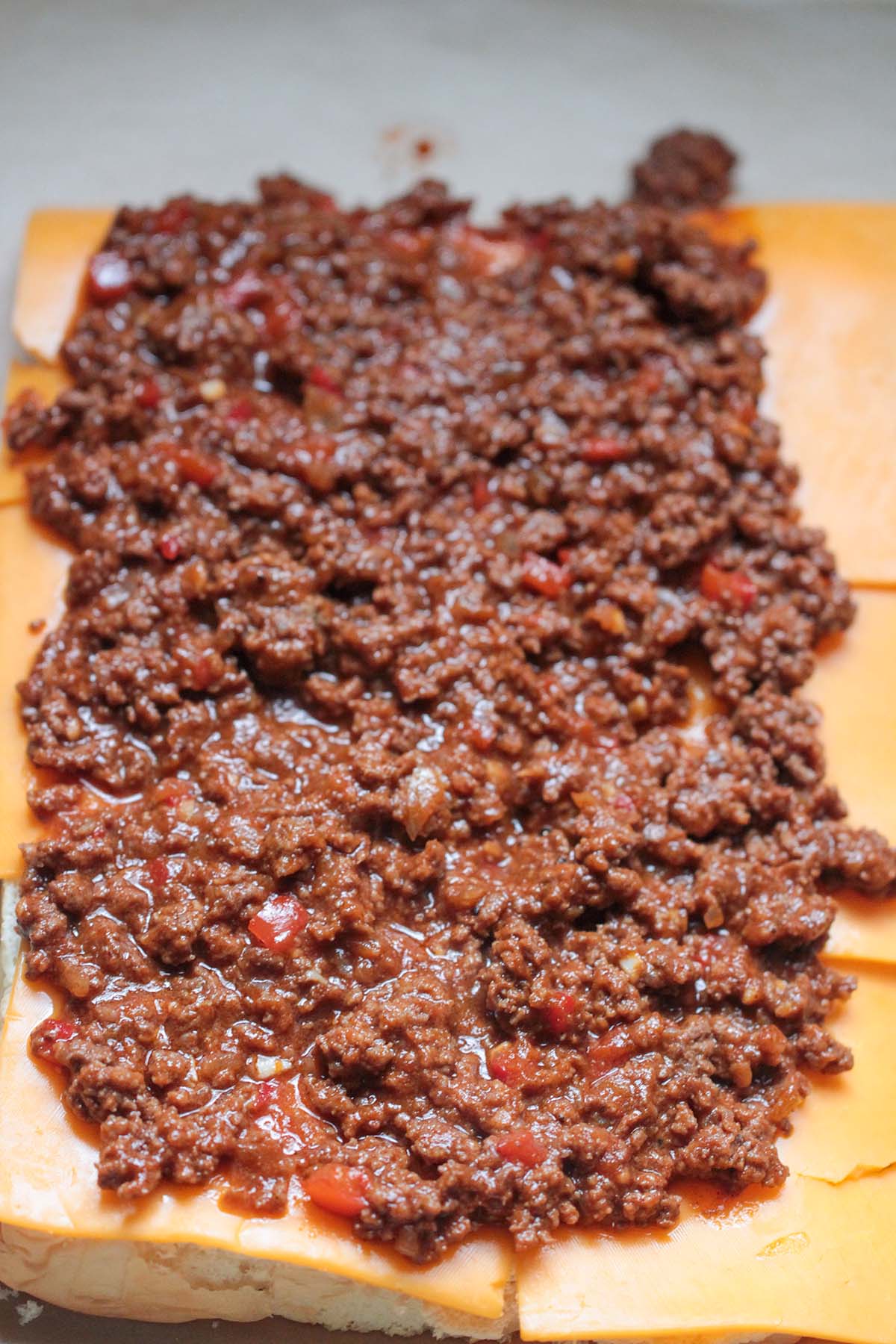 ground beef, cheese, and bread. 