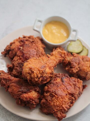 buttermilk fried chicken on a plate.