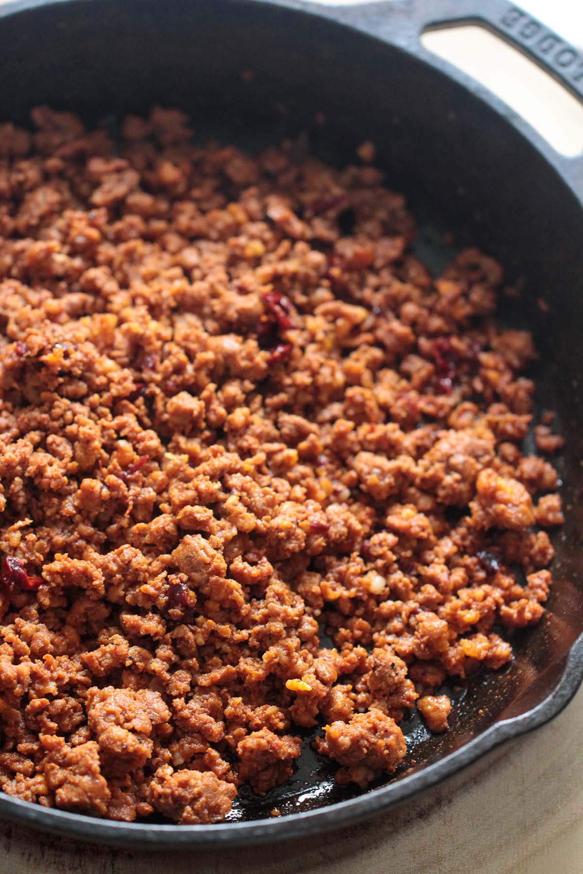 cooked ground chorizo in a black skillet. 