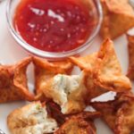 crab rangoons with sweet chili sauce on the side.