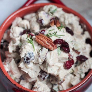cranberry pecan chicken salad in a red bowl.