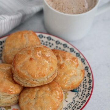 pastelitos de carne with a cup of coffee.