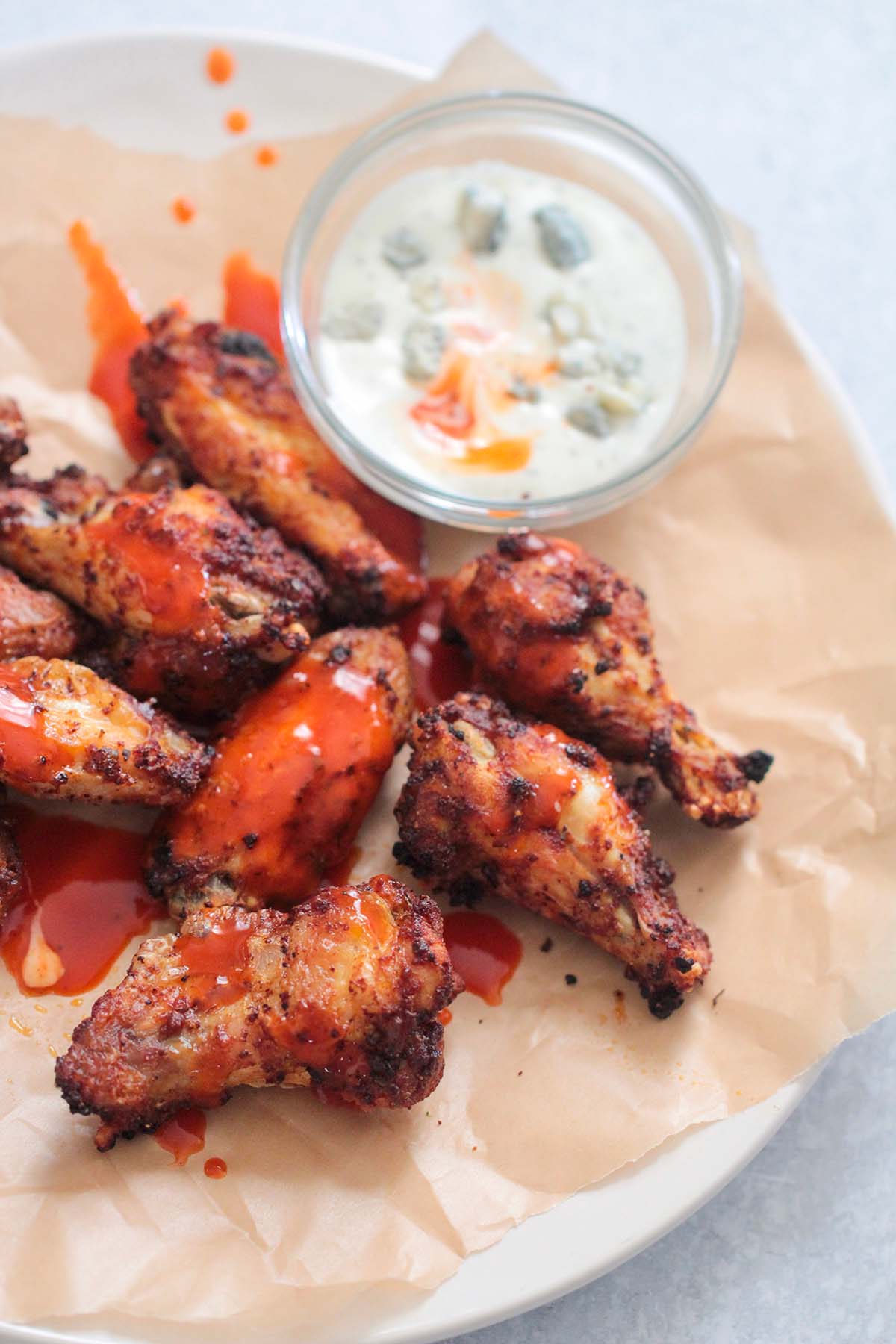 chicken wings with buffalo sauce on top. 