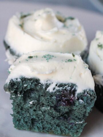 the inside of a blue velvet cupcake with cream cheese frosting