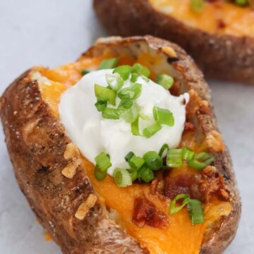 air fryer loaded baked potatoes up close.