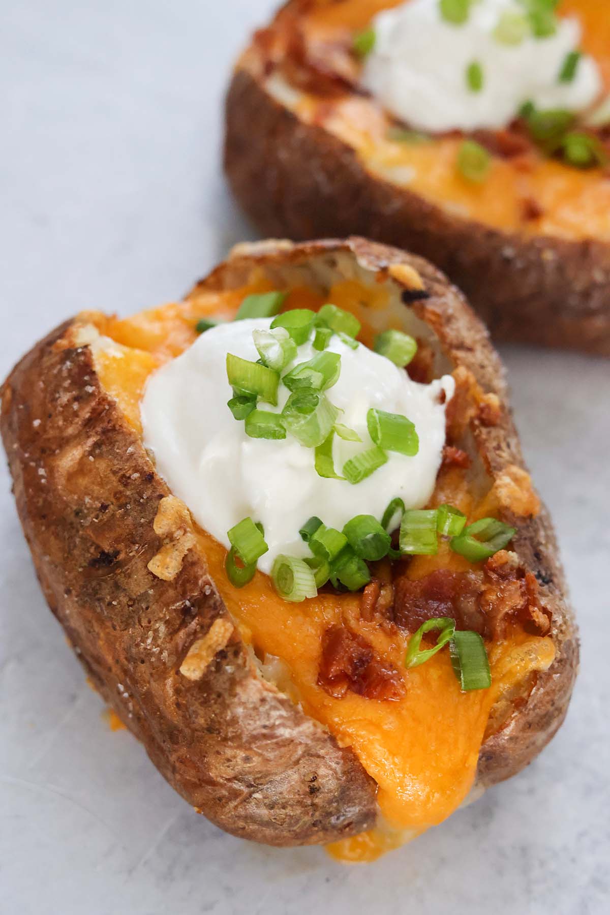 air fryer loaded baked potatoes up close. 