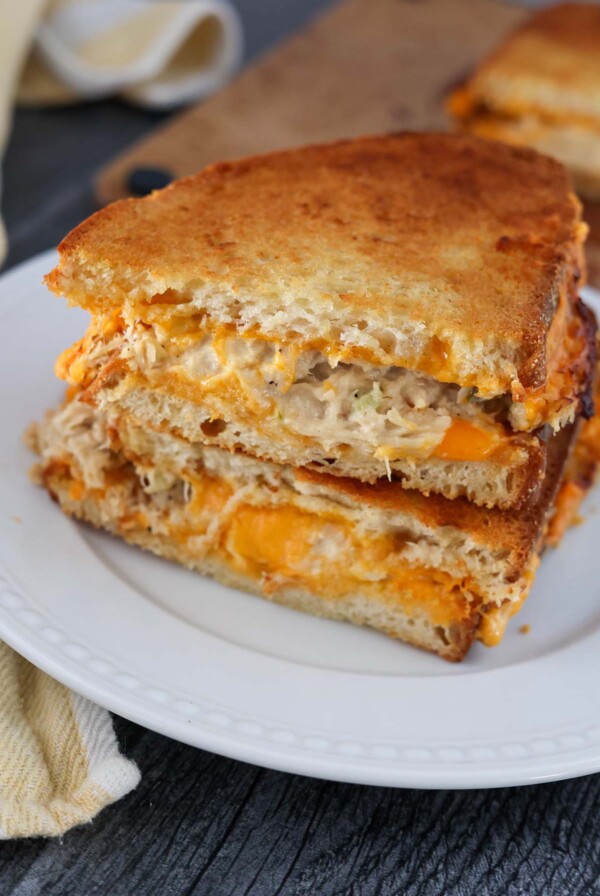 air fryer tuna melt sandwiches on a white plate.