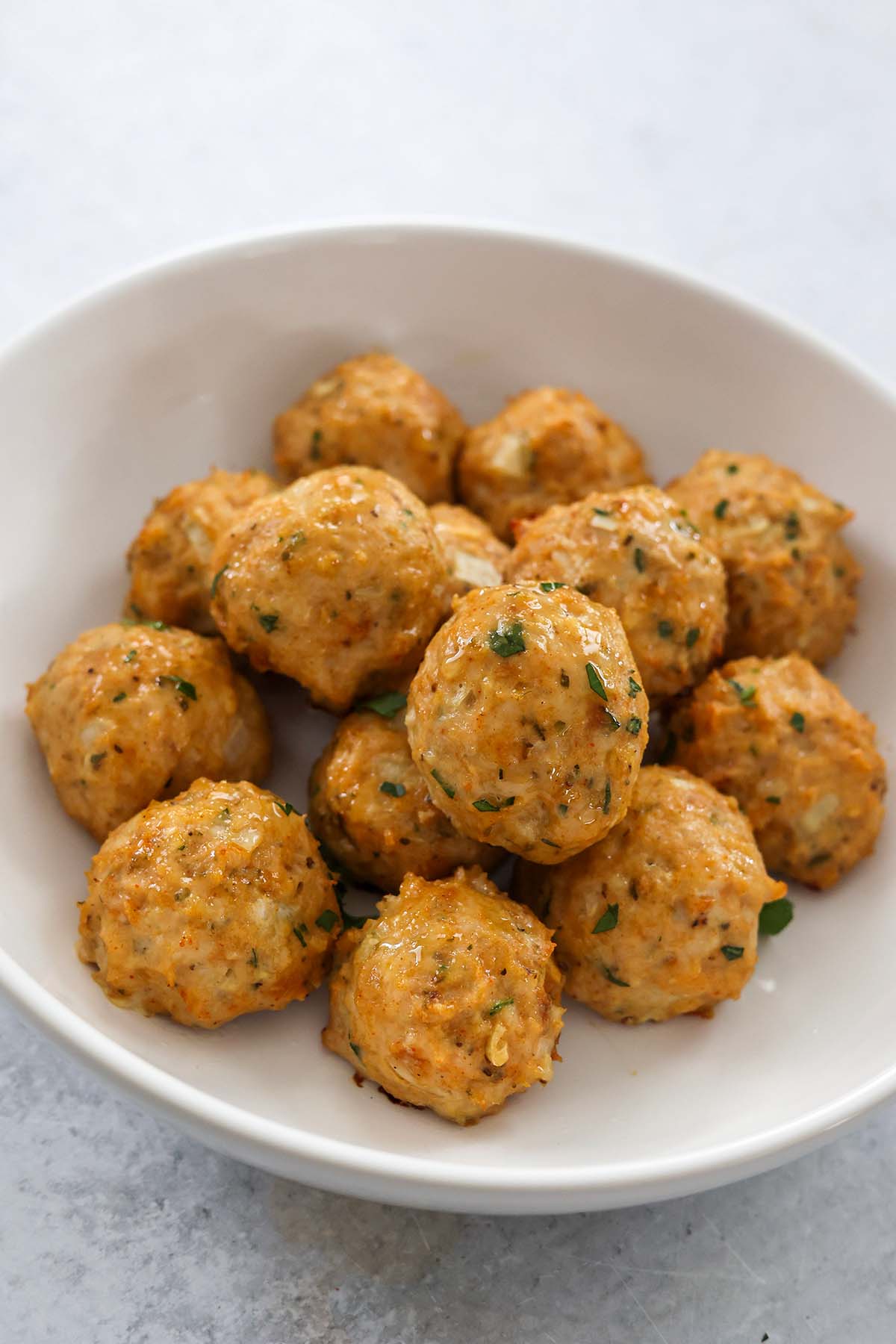 baked chicken meatballs up close. 
