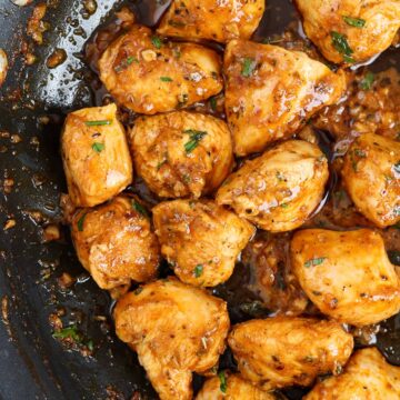 garlic butter chicken bites in a skillet.