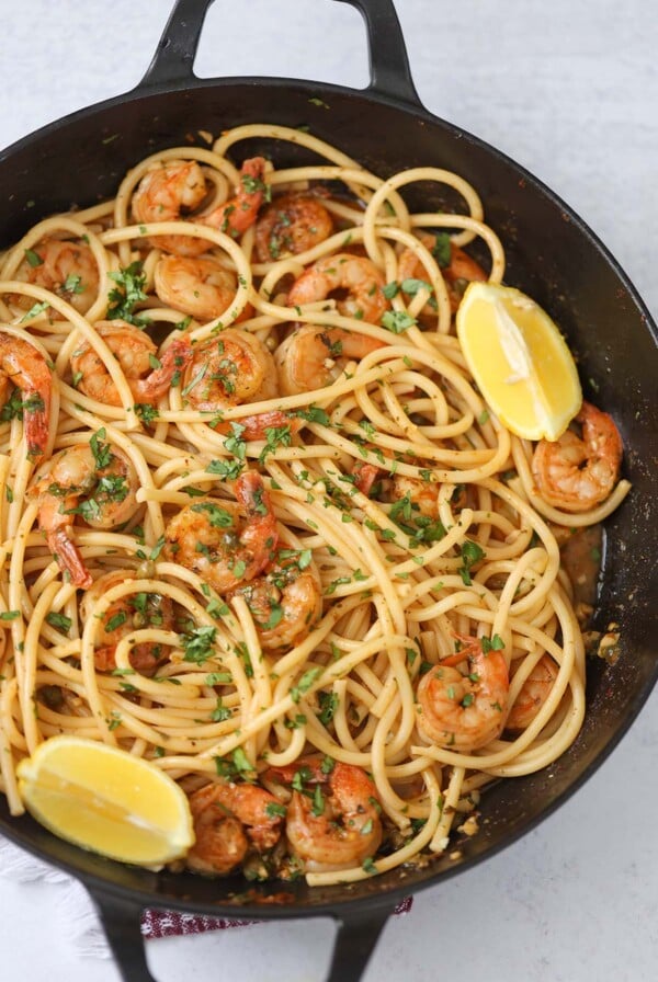 Cajun shrimp scampi with pasta in a skillet.