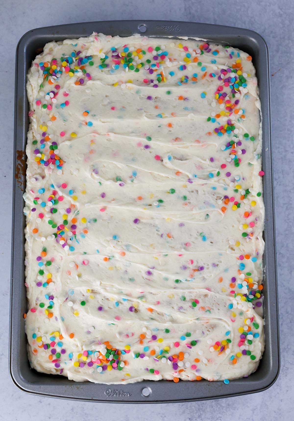funfetti sheet cake with vanilla buttercream and sprinkles. 