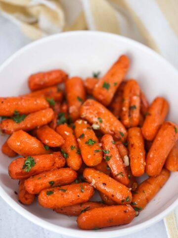 Air fryer honey carrots in a bowl.