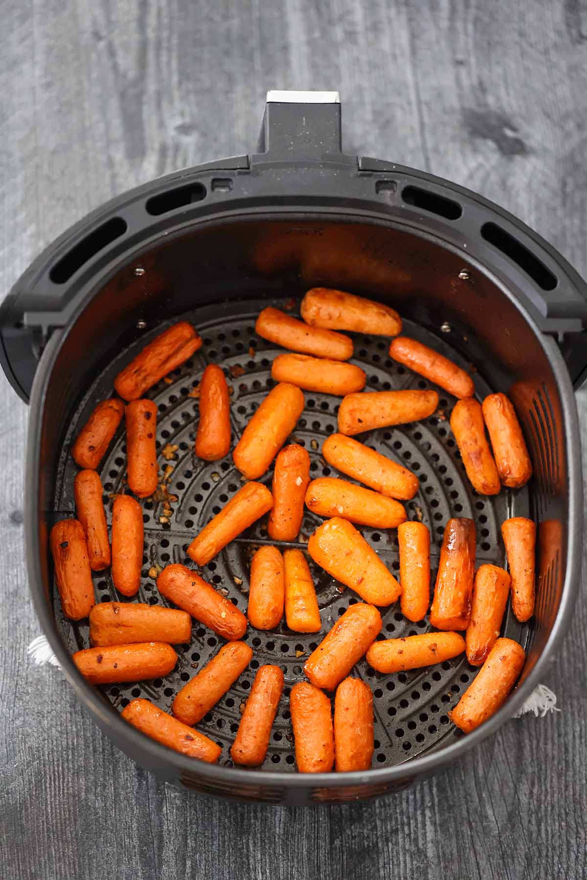 baby carrots in the air fryer basket. 
