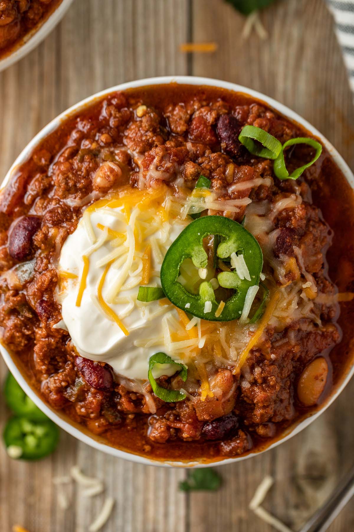 Chili with sour cream, cheese, and jalapenos. 
